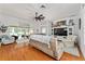 Bright living room with hardwood floors, large TV, and comfortable seating at 219 Carrera Dr, The Villages, FL 32159