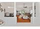 Open-concept living area with hardwood floors, columns, and bright natural light at 219 Carrera Dr, The Villages, FL 32159