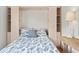 Close up of Murphy bed with custom cabinetry and side lighting; ready for guests at 219 Carrera Dr, The Villages, FL 32159