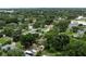 Expansive aerial view of a residential area with lush greenery and scattered houses at 2202 Butler St, Leesburg, FL 34748