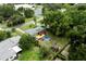 Aerial view showcasing a home with a private backyard, deck, and above-ground pool at 2202 Butler St, Leesburg, FL 34748
