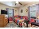 Small bedroom with colorful decor, a ceiling fan, and a single bed at 2202 Butler St, Leesburg, FL 34748