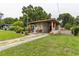 Charming single-story home with a covered carport and well-maintained lawn at 2202 Butler St, Leesburg, FL 34748