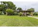 Charming single-story home with a covered carport, well-kept lawn and mature landscaping at 2202 Butler St, Leesburg, FL 34748