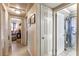 Bright hallway leading to various rooms, including a bathroom with a shower at 2202 Butler St, Leesburg, FL 34748