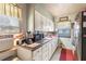 Traditional kitchen with white cabinetry and ample counter space at 2202 Butler St, Leesburg, FL 34748