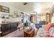 Open-concept living room with hardwood floors and plenty of natural light at 2202 Butler St, Leesburg, FL 34748