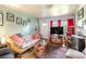Comfortable living room featuring a sofa, TV, and a unique wooden trunk at 2202 Butler St, Leesburg, FL 34748