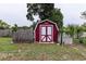 Red storage shed in backyard at 2202 Butler St, Leesburg, FL 34748