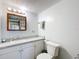 Clean and functional bathroom with a white vanity, toilet, and simple fixtures, ready for personal touches at 239 Rue De Fontaine, Tavares, FL 32778