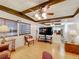 Cozy living room with wood floors, ceiling fan, and stylish furnishings, creating a welcoming atmosphere at 239 Rue De Fontaine, Tavares, FL 32778