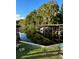 Waterfront property with boat dock in a lush, green environment at 239 Rue De Fontaine, Tavares, FL 32778