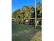 Waterfront property with boat dock in a lush, green environment at 239 Rue De Fontaine, Tavares, FL 32778