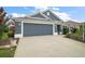 Charming single-story house with a two car garage and well-maintained landscaping at 2448 Bachman Path, The Villages, FL 32162