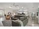 Spacious living room features modern gray tones, an open floor plan, and plenty of natural light at 2448 Bachman Path, The Villages, FL 32162