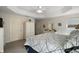 Bright bedroom features a trey ceiling, neutral colors, and leads to the ensuite bathroom and closet at 2448 Bachman Path, The Villages, FL 32162
