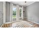 Bright bedroom with wood floors, 2 windows, and soft natural light at 263 Ne 1St St, Webster, FL 33597