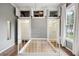 Bedroom features wood floor, closets, storage cabinets and bright windows at 263 Ne 1St St, Webster, FL 33597