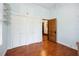 Bedroom with hardwood floors, natural light, and closet space at 263 Ne 1St St, Webster, FL 33597