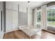 Bedroom features wood floor, closets, storage cabinets and bright windows at 263 Ne 1St St, Webster, FL 33597