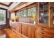 Charming dining room features built-in cabinetry with glass doors and ample natural light at 263 Ne 1St St, Webster, FL 33597