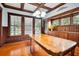 Beautiful dining room features coffered ceilings and ornate built-in wood cabinetry at 263 Ne 1St St, Webster, FL 33597