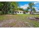 Charming cottage-style home with a metal roof and spacious yard at 263 Ne 1St St, Webster, FL 33597