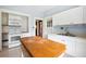 Bright kitchen featuring white cabinetry, modern appliances, and a butcher block kitchen island at 263 Ne 1St St, Webster, FL 33597
