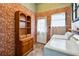 Laundry room with brick walls, cabinet storage, a bright window, and modern washer and dryer at 263 Ne 1St St, Webster, FL 33597