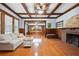 Sophisticated living room featuring a cozy fireplace, coffered ceilings, and detailed woodwork at 263 Ne 1St St, Webster, FL 33597