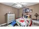 Comfortable bedroom with ample natural light and whimsical decor to promote relaxation at 26601 Otter Creek Ln, Leesburg, FL 34748