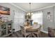 Charming dining room with natural light, complemented by stylish furnishings and decor creating an inviting space at 26601 Otter Creek Ln, Leesburg, FL 34748