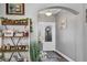 Charming foyer featuring decorative shelves and a view into the entryway at 26601 Otter Creek Ln, Leesburg, FL 34748