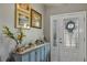 Bright foyer with decorative accents, showcasing a welcoming entrance and stylish decor at 26601 Otter Creek Ln, Leesburg, FL 34748
