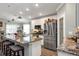 Modern kitchen featuring stainless steel appliances, granite countertops, and ample cabinet space at 26601 Otter Creek Ln, Leesburg, FL 34748