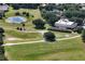Aerial view of golf course in community at 26917 White Plains Way, Leesburg, FL 34748