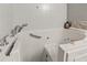 Close up of a clean white bathtub with jacuzzi jets and chrome fixtures at 26917 White Plains Way, Leesburg, FL 34748