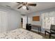 Bright bedroom with hardwood floors, cozy bed, and plenty of natural light from the window at 26917 White Plains Way, Leesburg, FL 34748