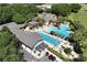 Aerial view of the community pool area, perfect for relaxation and recreation at 26917 White Plains Way, Leesburg, FL 34748