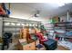 Spacious garage with ample storage shelving and a functional automatic door opener at 26917 White Plains Way, Leesburg, FL 34748