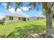 Lush green lawn in the backyard, offering a tranquil outdoor space and ample space to relax at 2745 Shearwater St, Clermont, FL 34711