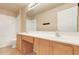 Neutral bathroom featuring a double vanity with a tile surround shower and tile flooring at 2745 Shearwater St, Clermont, FL 34711