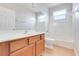 Bathroom featuring single vanity, tiled shower, and neutral finishes at 2745 Shearwater St, Clermont, FL 34711