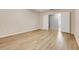 Bright bedroom featuring an entrance and light wood-look flooring at 2745 Shearwater St, Clermont, FL 34711