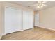 Bedroom featuring ceiling fan and double door closet at 2745 Shearwater St, Clermont, FL 34711