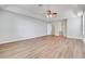 Spacious bedroom features a tray ceiling with ceiling fan and wood-look flooring at 2745 Shearwater St, Clermont, FL 34711