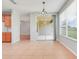 Bright dining area with tile floors, natural light and access to screened in patio at 2745 Shearwater St, Clermont, FL 34711