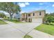 Attractive two-story home with a two-car garage, landscaped front yard and appealing stone accents at 2745 Shearwater St, Clermont, FL 34711