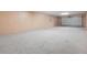 Spacious garage featuring a garage door and concrete flooring at 2745 Shearwater St, Clermont, FL 34711
