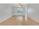 Bright living room featuring tiled floor and a large window at 2745 Shearwater St, Clermont, FL 34711